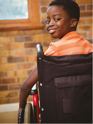 Boy smiling in wheelchair
